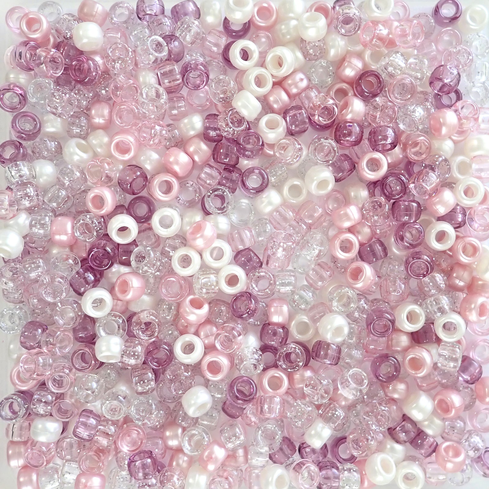 Pink Ice Mix Plastic Pony Beads. Size 6 x 9 mm.