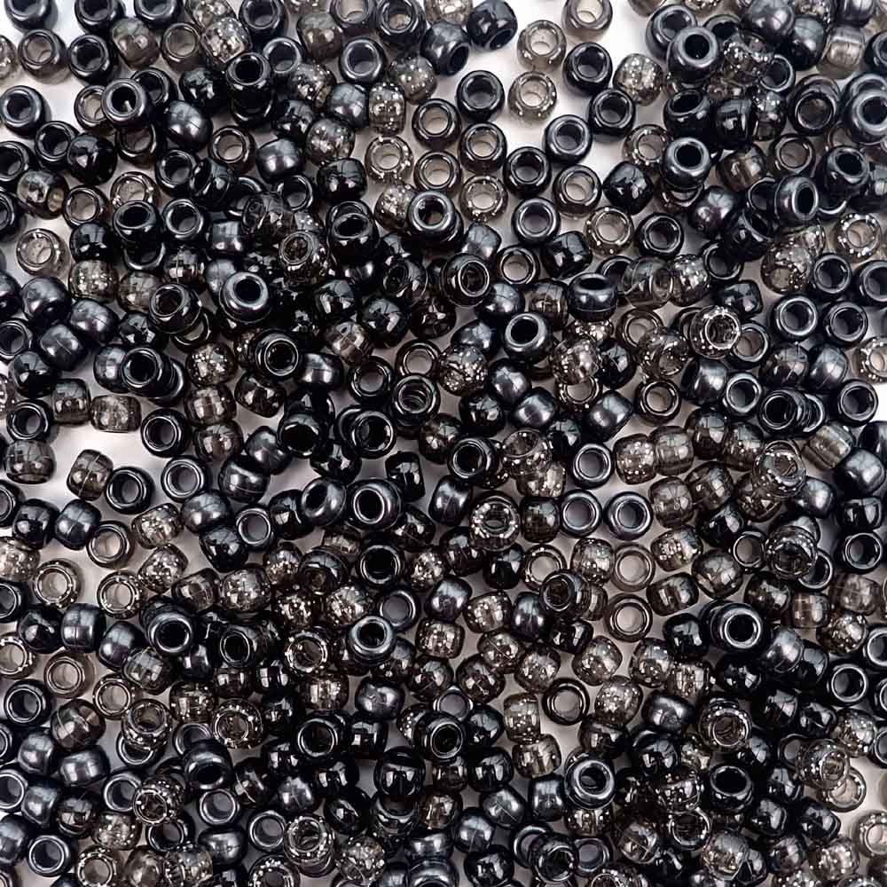 Plastic pony beads in a mix of different shades of black