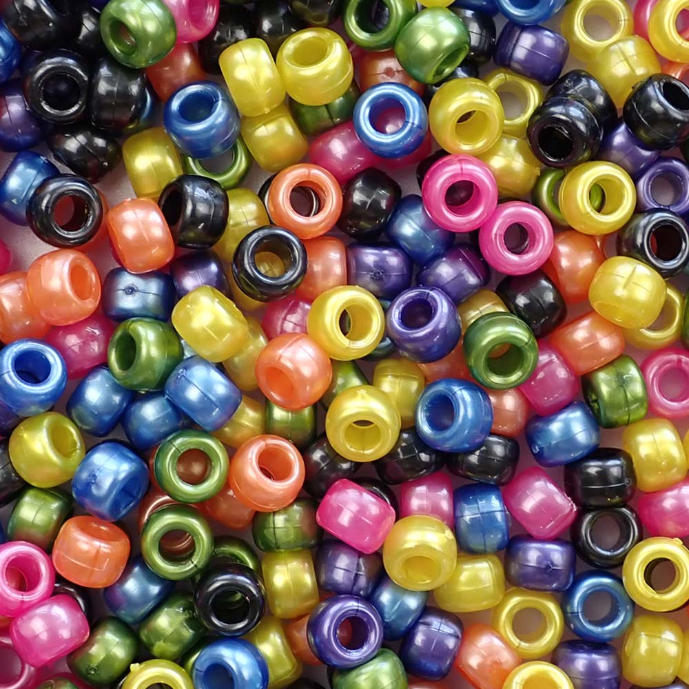 A mix of pony beads in dark pearlized colors