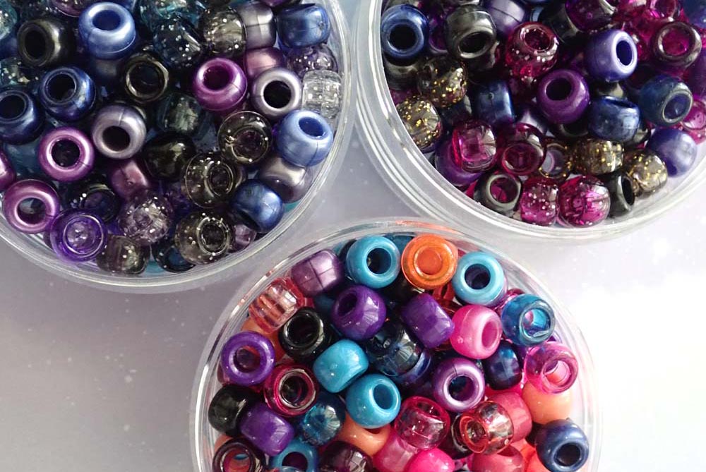 containers filled with dark & moody pony beads mixes