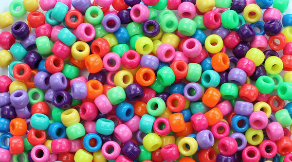 Colorful plastic pony beads in various bright colors.