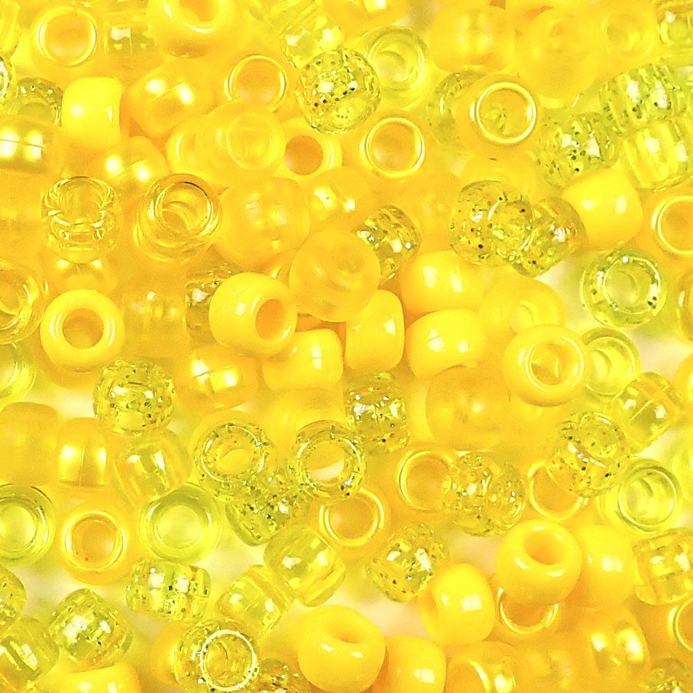 mix of yellow colors of 6 x 9mm plastic pony beads