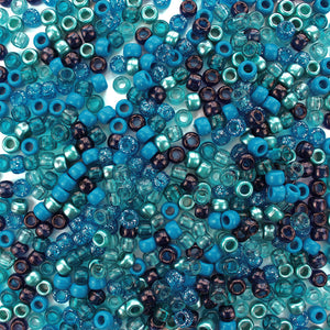 Plastic pony beads in a mix of different shades of blue and turquoise