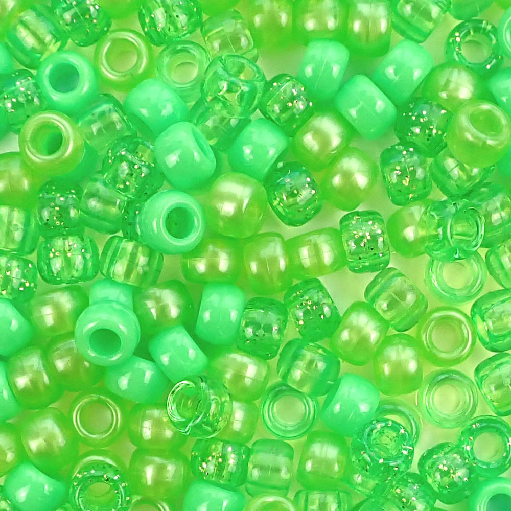 Plastic pony beads in a mix of different shades of lime green