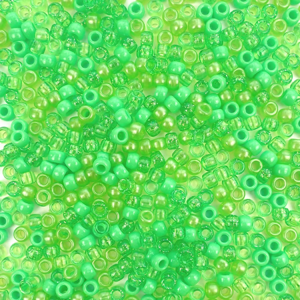 Plastic pony beads in a mix of different shades of lime green